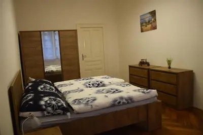 a bedroom with a bed and a dresser and a mirror at Tiva Downtown Apartments in Prague