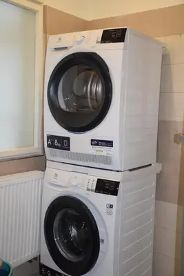a washing machine and a dryer in a room at Tiva Downtown Apartments in Prague