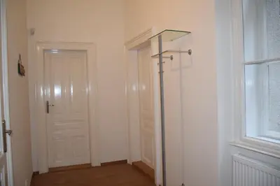 a white room with a door and a window at Tiva Downtown Apartments in Prague