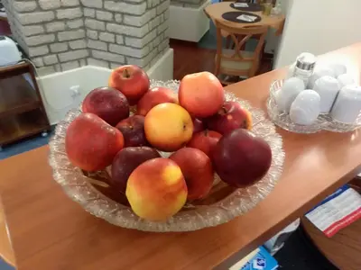 a bowl of fruit sitting on a table at Villa A. Malka in Poděbrady