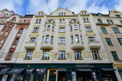 a large building in the middle of a street at Art Nouveau Residence in Prague