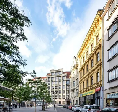 a view of a city street with buildings at Kafka's Head Apartment in Prague