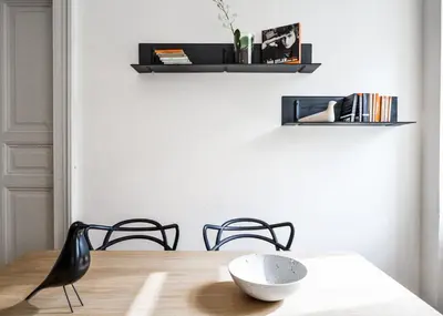 a dining room table with a bowl on top of it at Kafka's Head Apartment in Prague
