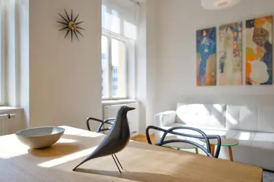a dining room table with a bowl on top of it at Kafka's Head Apartment in Prague