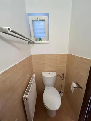 a bathroom with a toilet and a window at Motel R10 in Mladá Boleslav
