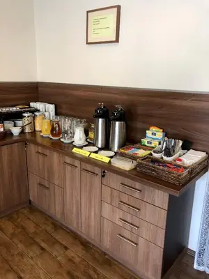 a kitchen with a counter with food on it at Motel R10 in Mladá Boleslav