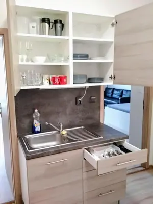 a kitchen with a sink and a counter top at Cozy Private Apartment in Prague