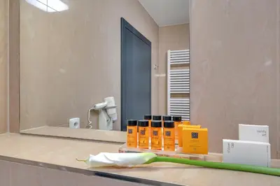 a toothbrush sitting on a counter in front of a mirror at Spa Hotel Felicitas in Poděbrady