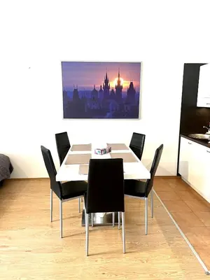 a dining room with a table and chairs at Maria Apartments - Free Parking in Prague