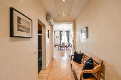 a hallway with a couch and a dining room at Panoramic Loft in Prague