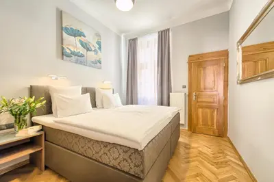 a bedroom with a large bed in a room at Spacious And Bright Apartment Dusni 13 in Prague
