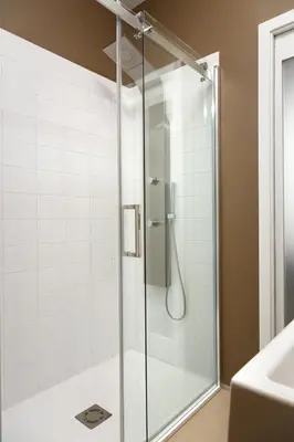 a shower with a glass door in a bathroom at Skyhotel Prague in Prague