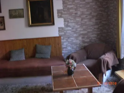 a living room with a couch and a coffee table at pension Kalik in Prague