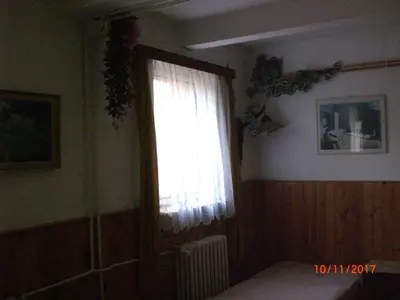 a window in a room with a radiator and a curtain at pension Kalik in Prague