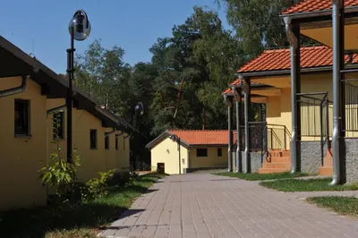 a walkway between two buildings on a street at Resort Beach Nová Živohošť in Křečovice
