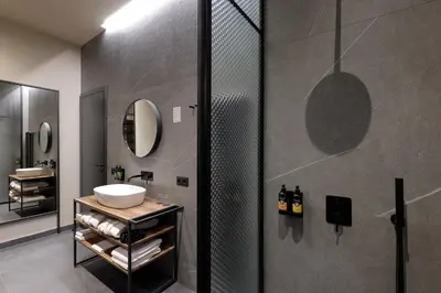 a coffee table with a laptop on top of it at Hotel Prokop Square in Prague