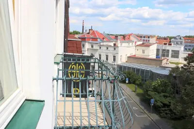 a view of a city from the balcony of a building at Penzion Homer Poděbrady in Poděbrady