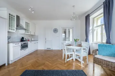 a bedroom with two twin beds and a window at Charles Apartment in Prague