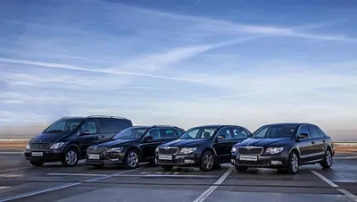 a group of four cars parked in a parking lot at MOODs Charles Bridge in Prague