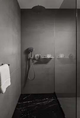 a bathroom with a shower with a glass door at MOODs Charles Bridge in Prague