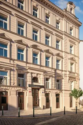 a large white building on a city street at MOODs Charles Bridge in Prague