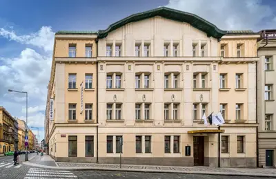 a large building on the corner of a street at Maestro by Adrez in Prague
