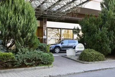a car parked in front of a building at Olympik Tristar in Prague
