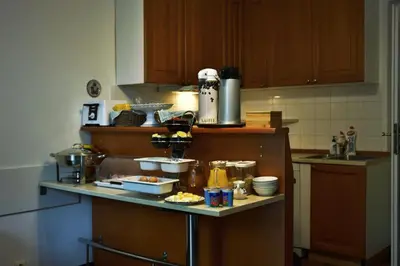 a kitchen counter with alot of food on it at Vila Josefina in Prague