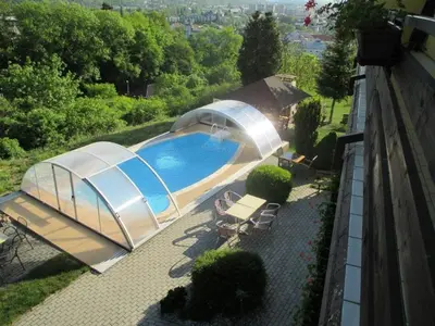 an overhead view of a swimming pool with a domedescription at Pension PRIMUS in Beroun