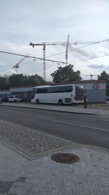 a bus parked on the side of a street at Alexis in Prague