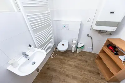 a bathroom with a sink and a toilet at Slavikova Residence in Prague