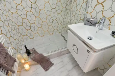 a bathroom with a sink and a mirror at Vogue apartment near by Wenceslas Square in Prague