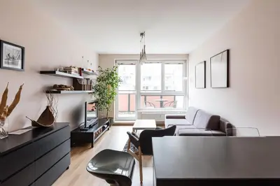 a living room with a couch and a table at The SUNNY PRAGUE APPARTMENT&Garage in Prague