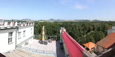 an aerial view of a building with a red roof at Caramell in Louny