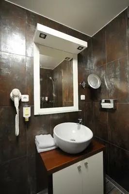 a bathroom with a sink and a mirror at Caramell in Louny