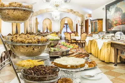 a buffet with many different types of food at Charles Bridge Palace in Prague