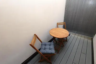 a table and two chairs sitting next to a table at Luxury apartments Krocínova in Prague