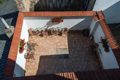 an overhead view of a staircase with plants and flowers at Penzion Homér Slaný in Slaný