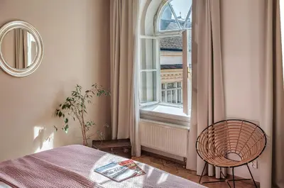 a bedroom with a bed and a window at 6 Continents Apartments by Adrez in Prague