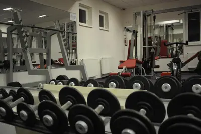a room with a boxing gym with balls on the floor at Hotel Olympionik in Mělník