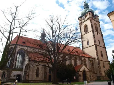 a large church with a clock tower on top of it at Hotel Swami in Mělník