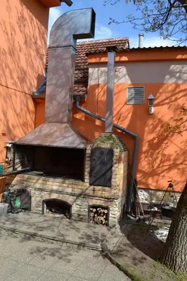 a large brick oven sitting outside of a house at Hotel Swami in Mělník