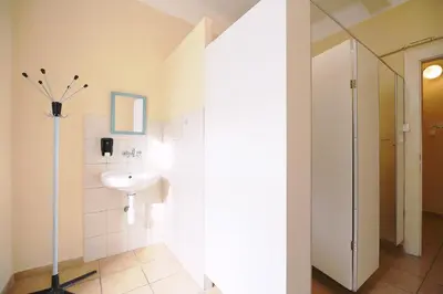 a bathroom with a sink and a mirror at Hostel Dakura in Prague
