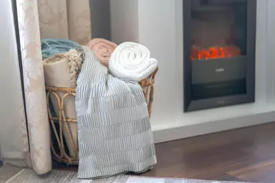 a pile of towels sitting next to a fireplace at Old Town Square Apartment in Prague