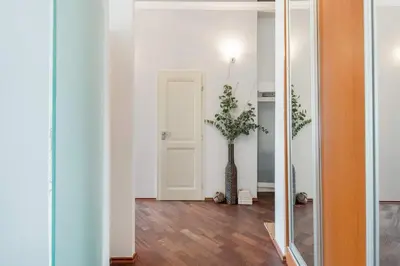 a hallway with a vase with a plant in it at Old Town Square Apartment in Prague