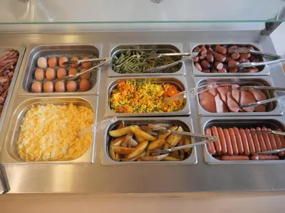 a refrigerator filled with lots of different types of food at Abitohotel in Prague