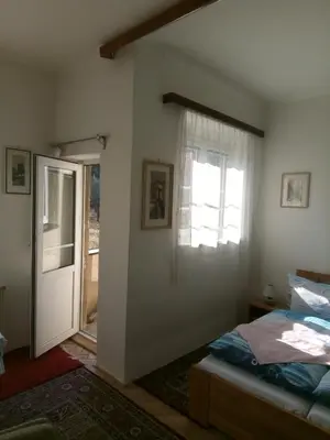 a bedroom with a bed and a window at apartricanova in Prague
