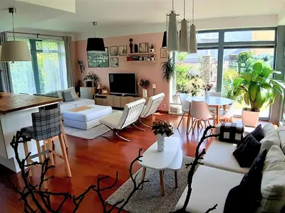 a living room with a couch and a table at Holiday Home Řeporyje by Interhome in Prague