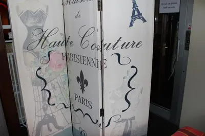 a door with a sign that reads paris couture ferrateurs and parks at Hotel Praha Club bed & breakfast in Prague