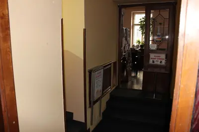 a hallway with a stairway leading to a room at Hotel Praha Club bed & breakfast in Prague